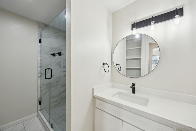 bathroom featuring baseboards, a shower stall, and vanity