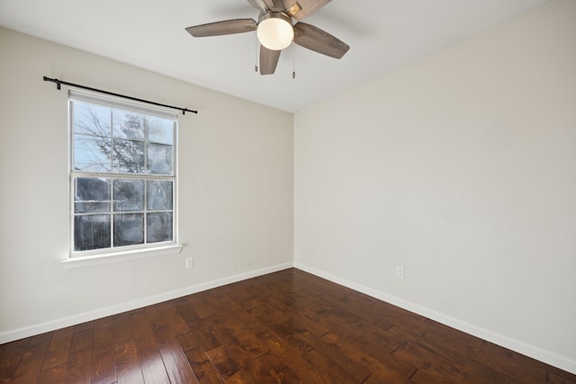 empty room with a ceiling fan, baseboards, and hardwood / wood-style floors