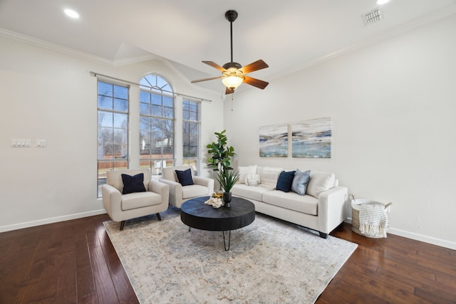 living area with visible vents, baseboards, ceiling fan, dark wood-style flooring, and crown molding