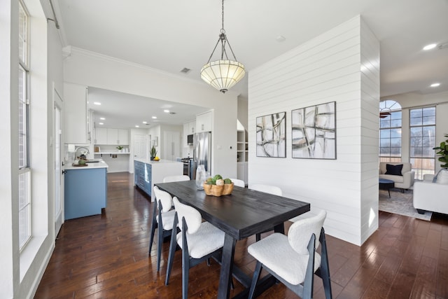 dining area with visible vents, ornamental molding, dark wood-type flooring, and recessed lighting