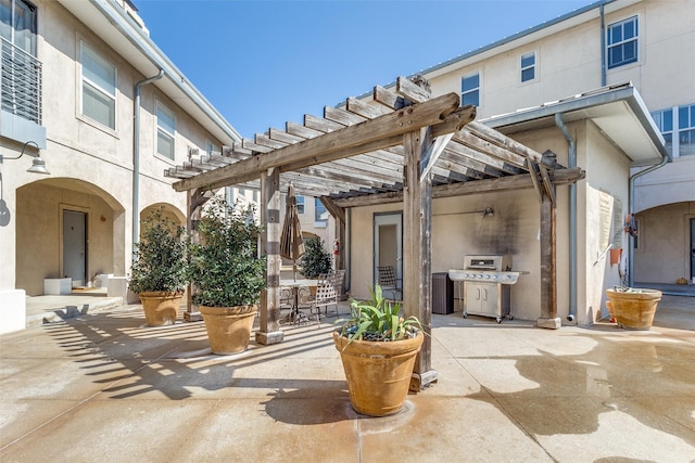 view of patio / terrace featuring grilling area and a pergola