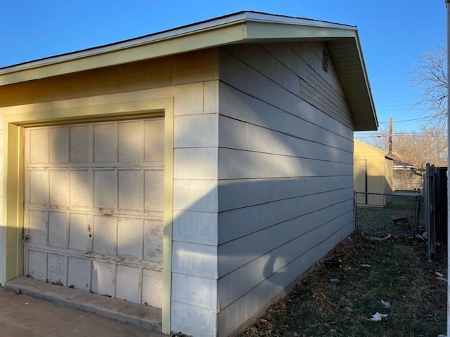 garage with fence