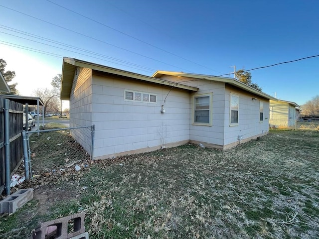 view of side of property featuring fence