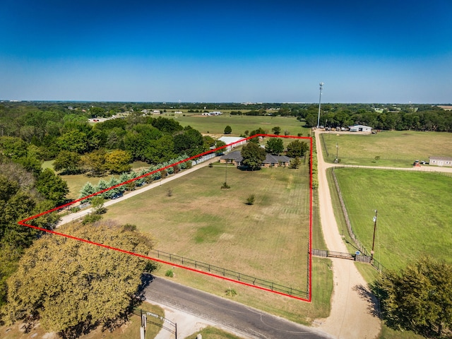 birds eye view of property with a rural view