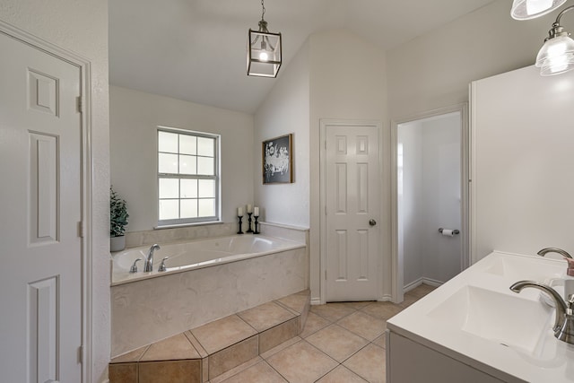 bathroom with lofted ceiling, a sink, a bath, and tile patterned floors