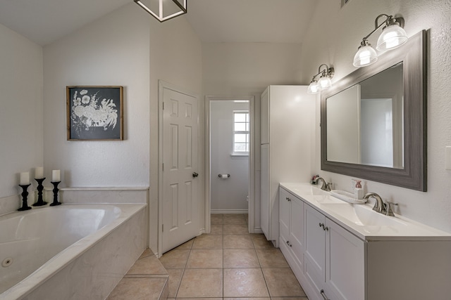 bathroom featuring double vanity, a garden tub, a sink, and tile patterned floors