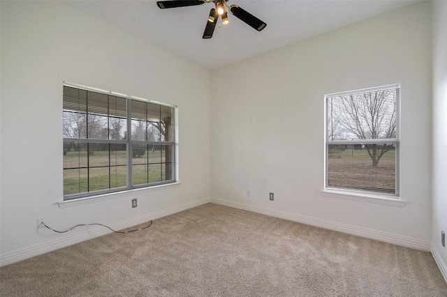 unfurnished room featuring baseboards, carpet, and a healthy amount of sunlight