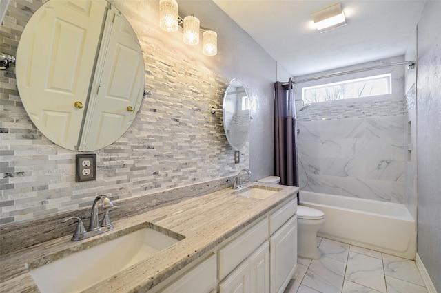 full bath featuring marble finish floor, a sink, toilet, and shower / tub combo with curtain