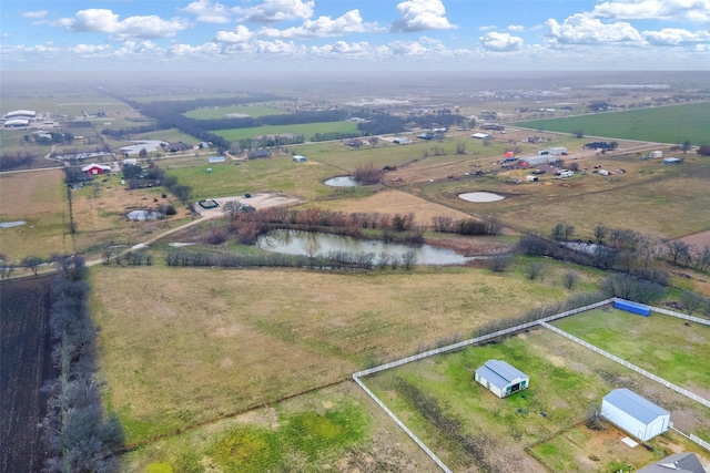 aerial view with a rural view and a water view