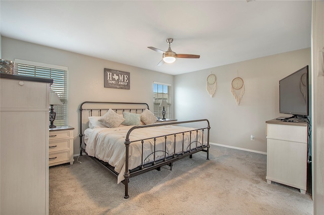 bedroom featuring a ceiling fan, baseboards, and carpet flooring