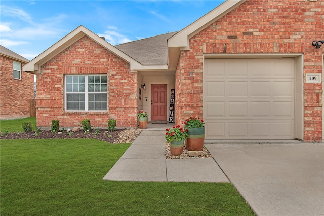 ranch-style home featuring an attached garage, brick siding, driveway, roof with shingles, and a front yard