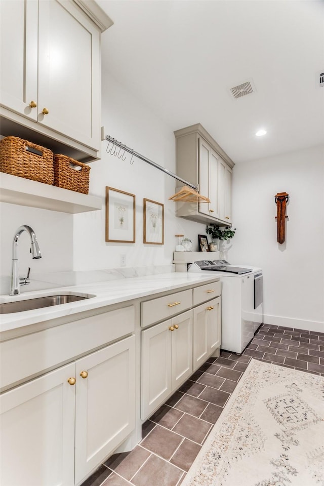 kitchen with visible vents, open shelves, a sink, and range