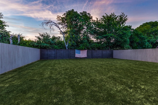 view of yard with a fenced backyard