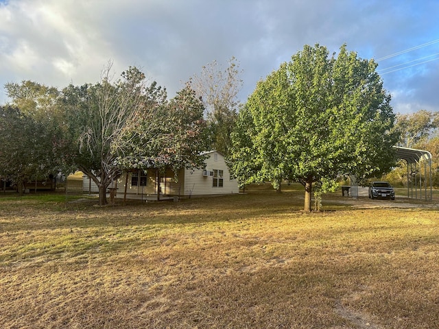 view of yard with a carport