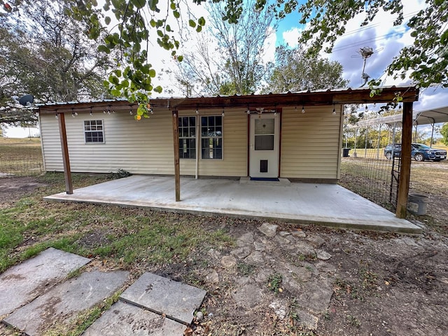 rear view of house featuring a patio