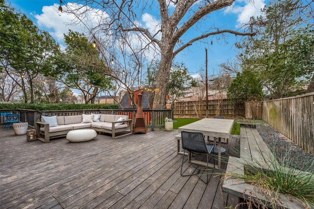 6306 Tremont St, Dallas, TX 75214 - wooden deck featuring an outdoor hangout area, outdoor dining space, and a fenced backyard