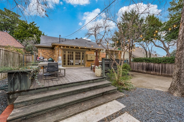 6306 Tremont St, Dallas, TX 75214 - deck with a fenced backyard, french doors, and outdoor dining space