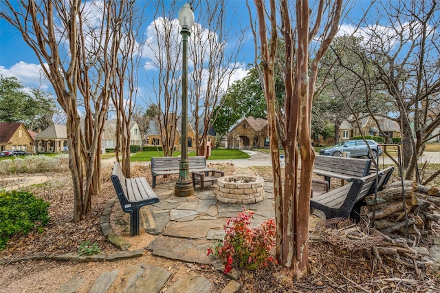 6306 Tremont St, Dallas, TX 75214 - view of patio / terrace with a residential view and a fire pit