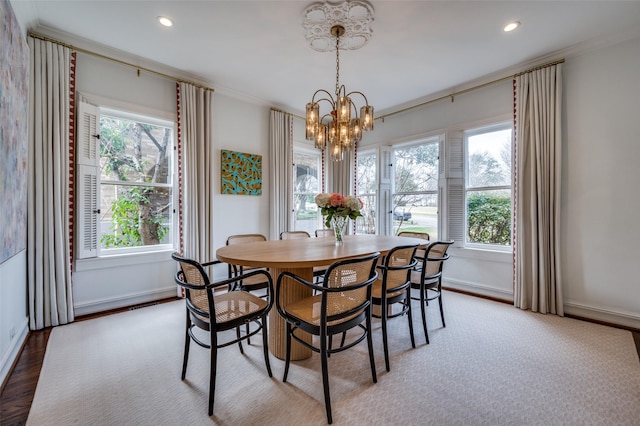 6306 Tremont St, Dallas, TX 75214 - dining area with a chandelier, baseboards, wood finished floors, recessed lighting, and ornamental molding