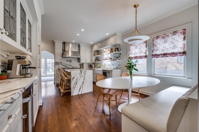 6306 Tremont St, Dallas, TX 75214 - dining room with crown molding, dark wood finished floors, and recessed lighting