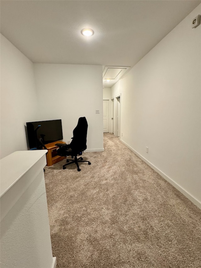 office featuring carpet floors, attic access, and baseboards