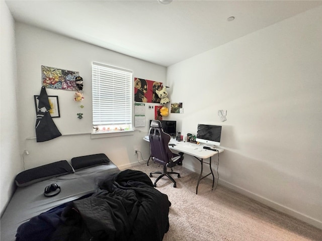 bedroom with baseboards and carpet flooring