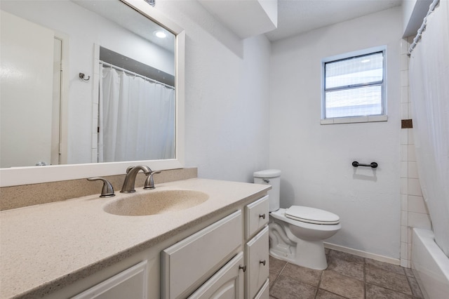 full bath featuring vanity, toilet, and baseboards