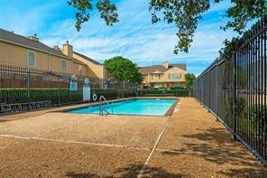 community pool featuring fence