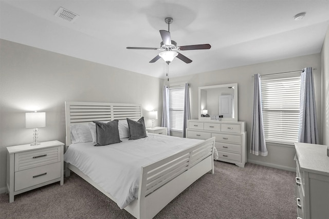 bedroom featuring light carpet, ceiling fan, visible vents, and baseboards