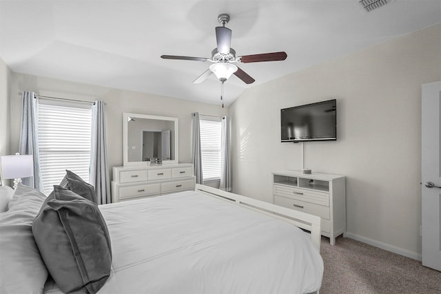 bedroom featuring light carpet, a ceiling fan, visible vents, and baseboards