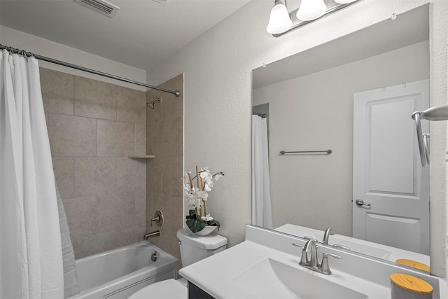 full bath featuring visible vents, a textured wall, toilet, shower / bath combo, and vanity