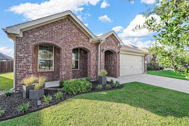 ranch-style house with a front yard, concrete driveway, brick siding, and an attached garage