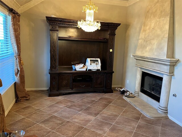 room details with baseboards, ornamental molding, a fireplace, and an inviting chandelier