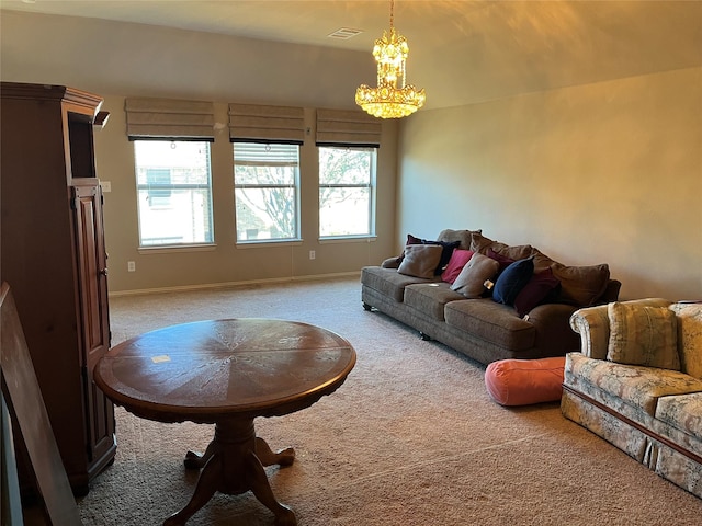 living room with baseboards, carpet floors, visible vents, and an inviting chandelier