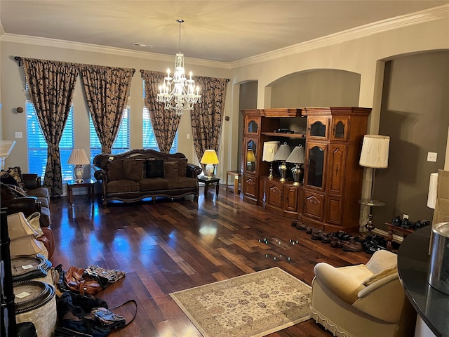 living room with ornamental molding, dark wood-style flooring, and a notable chandelier