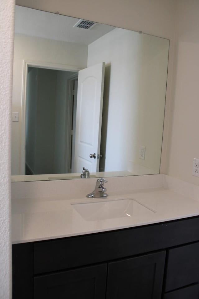 bathroom with visible vents and vanity