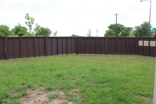 view of yard with a fenced backyard