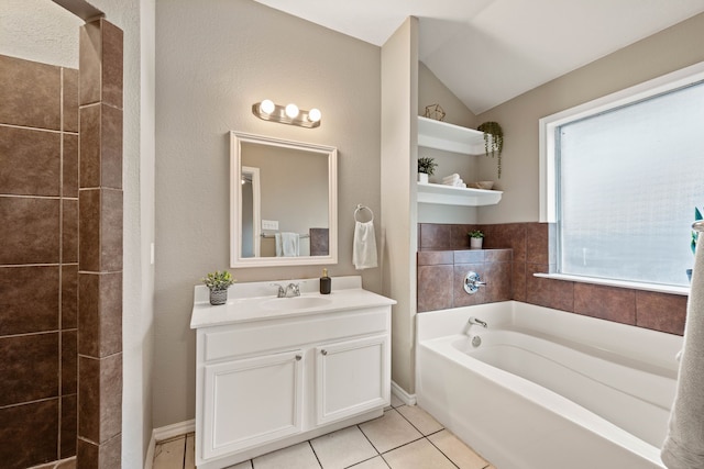 full bathroom with lofted ceiling, a garden tub, vanity, and tile patterned floors