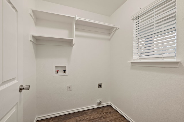 laundry room featuring dark wood-style floors, hookup for a washing machine, electric dryer hookup, laundry area, and baseboards