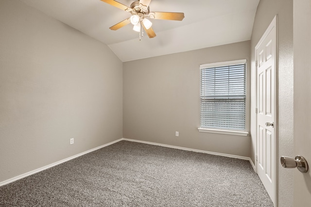 unfurnished bedroom featuring carpet floors, lofted ceiling, baseboards, and a ceiling fan