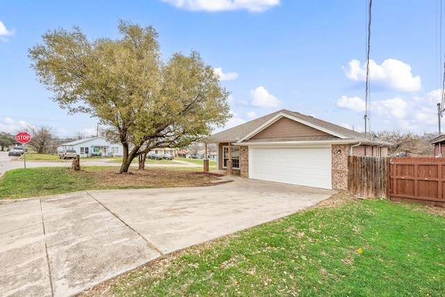 view of front of property featuring brick siding, driveway, a front lawn, and fence