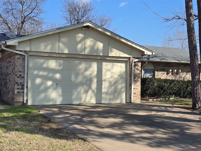 garage with concrete driveway