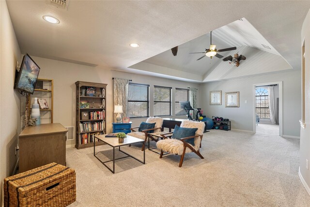 living area featuring visible vents, a tray ceiling, recessed lighting, baseboards, and light colored carpet