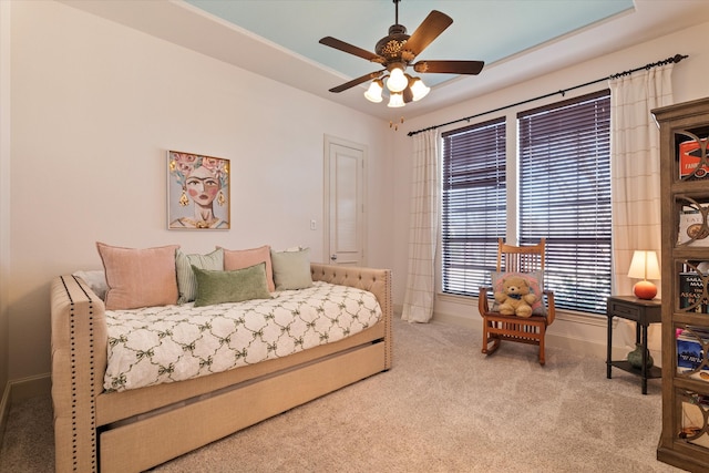 carpeted bedroom with baseboards and ceiling fan