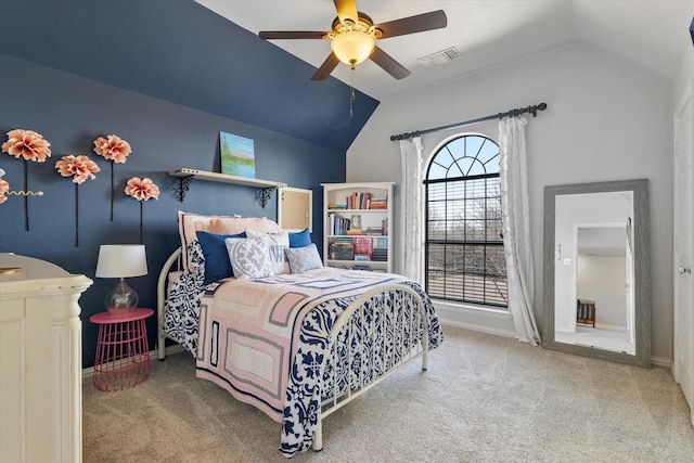 carpeted bedroom with a ceiling fan, lofted ceiling, baseboards, and visible vents