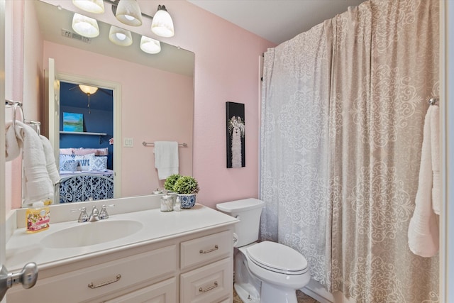 ensuite bathroom with visible vents, toilet, vanity, a shower with shower curtain, and ensuite bath