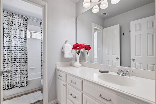 full bathroom featuring vanity, toilet, shower / bathtub combination with curtain, and visible vents