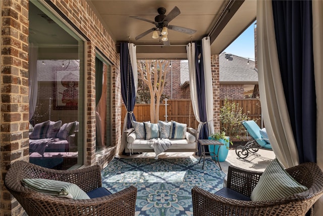 view of patio / terrace featuring an outdoor hangout area, a ceiling fan, and fence