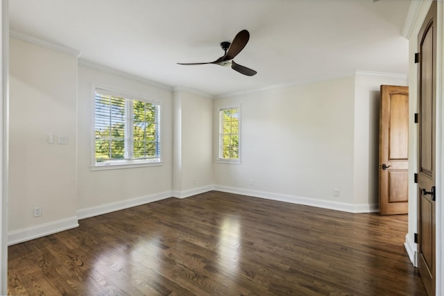 spare room with dark wood-style flooring, crown molding, baseboards, and ceiling fan