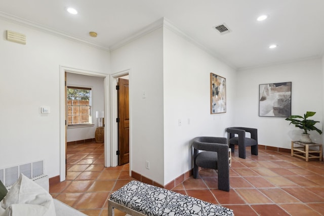 interior space featuring baseboards, tile patterned flooring, and crown molding